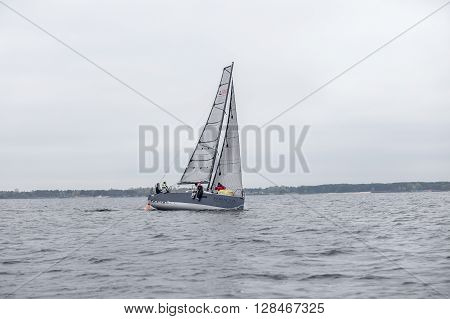 KYIV, UKRAINE - APRIL 26, 2016: Traning on the new model of yacht OceanTECH L30 on the Kyiv water reservoir or Kyiv SEA with Rodion Luka, L30 idea author, Silver Olympic medalist.