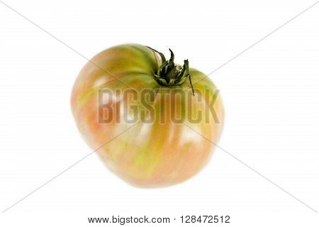Whole near ripe ox heart tomato Solanum lycopersicum