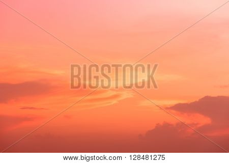 Orange sunset with moving cloud over the sky