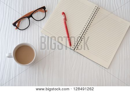 Workplace With Tablet, Paper, Pen And Cub Of Coffee On Work Table. Top View Shot