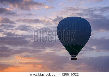 Balloon silhouette in the sunrise sky. Cappadocia, Turkey