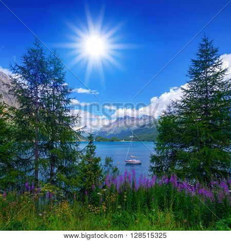 Amazing sunny day at Champferersee lake in the Swiss Alps. Silvaplana village, Switzerland, Europe.