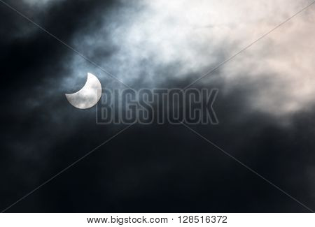 Dutovlje Slovenia. 20th March 2015. Partial solar eclipse seen through clouds over Central Europe at 14 minutes past noon CEST.