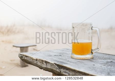 Mug With Wheat Beer On The Bench