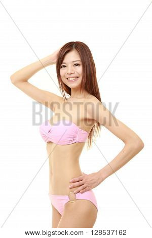 portrait of young Japanese woman in a pink bikini
