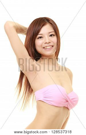 portrait of young Japanese woman in a pink bikini