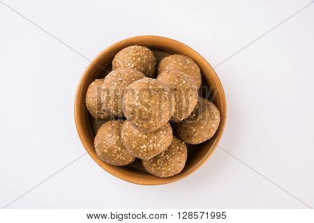 The indian sesame sweet or tilgul laddu, made up of jaggery and sesame seeds, hand made, round, indian sweet prepared in Makar Sankranti festival