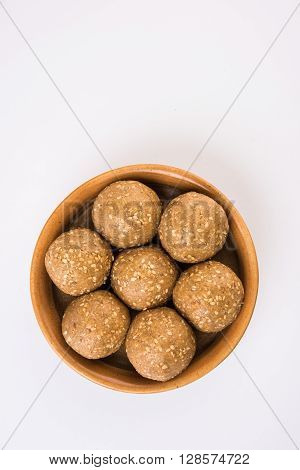 The indian sesame sweet or tilgul laddu, made up of jaggery and sesame seeds, hand made, round, indian sweet prepared in Makar Sankranti festival