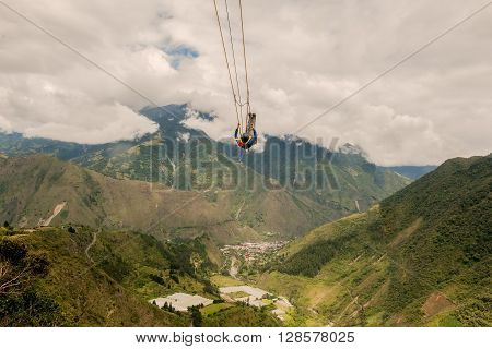 Unidentified Man Swinging On A Swing Called Flight Of The Condor Banos De Agua Santa Ecuador