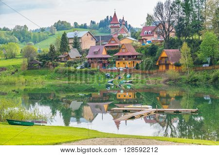 ZAWOZ, POLAND, MAY 2, 2016: small village on Solina lake shore (Bieszczady mountains,), in the beginning of May