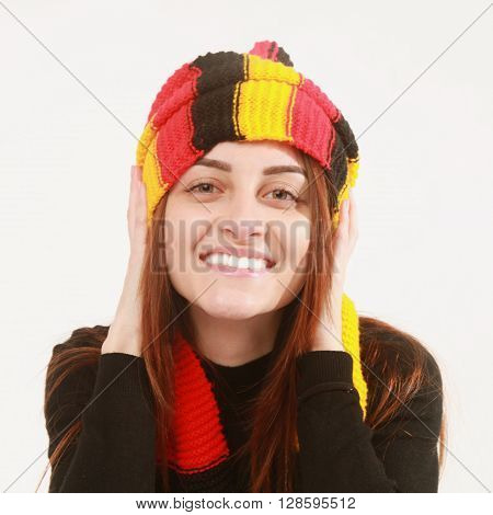 German soccer fan cheers football team in the national colors.
