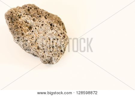 Closeup stone with many holes left side