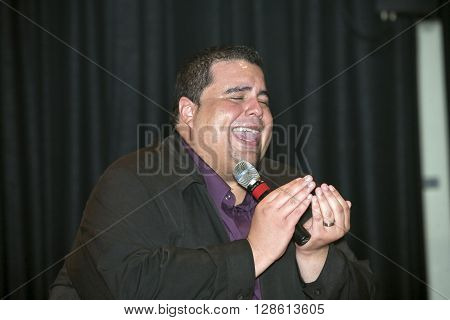 BRONX NEW YORK - MARCH 17: Reverend Edgar J. Cruz performs during a Christian concert for Realizing Possibilities ministry. Taken March 17 2012 in New York.