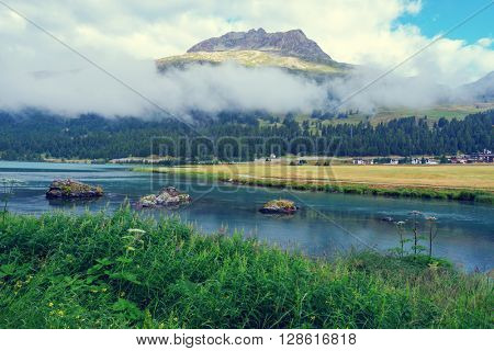 Amazing sunny day at Champferersee lake in the Swiss Alps. Silvaplana village, Switzerland, Europe.