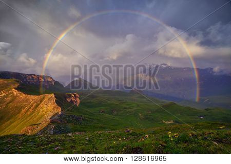 Amazing rainbow on the top of grossglockner pass, Alps, Switzerland, Europe.