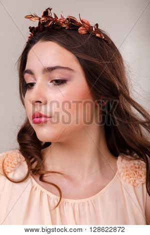 Portrait of a gorgeous brunette on a light background. Chic hair eyes and eyebrows.