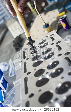 Hands Repairing A Car Engine With A Wrench