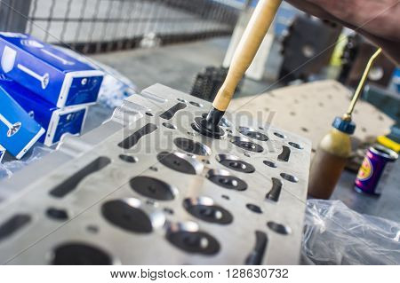 Hands Repairing A Car Engine With A Wrench