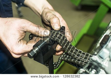 Hands Repairing A Car Engine With A Wrench