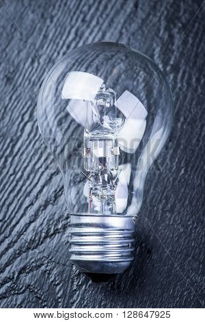 Tungsten Bulb On A Black Table