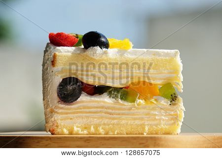 delicious fruit cake on the wood plate