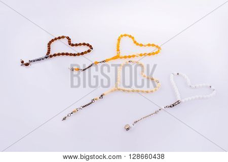 Tespihs forming a heart on a white background