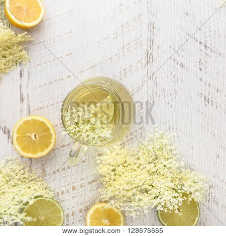 Elderflower syrup. Homemade elder flower syrup with a slice of lemon. Top view with copyspace