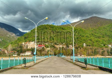 View of mountains from walkway on pier in Gagra Abkhazia HDR processing