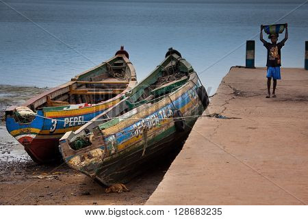 Sierra Leone, West Africa - June 2, 2013: the beaches of the Bunce Island, situated in Freetown Harbour, child while working