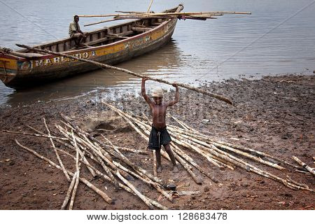 Sierra Leone, West Africa - June 2, 2013: the beaches of the Bunce Island, situated in Freetown Harbour, child while working