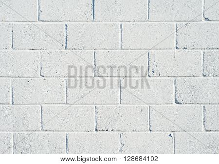 Whitewashed breezeblock wall close up.
