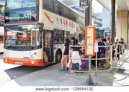 HONG KONG - JUNE 04, 2015: people waiting for boarding at A41 in airport. Hong Kong International Airport is the main airport in Hong Kong. It is located on the island of Chek Lap Kok