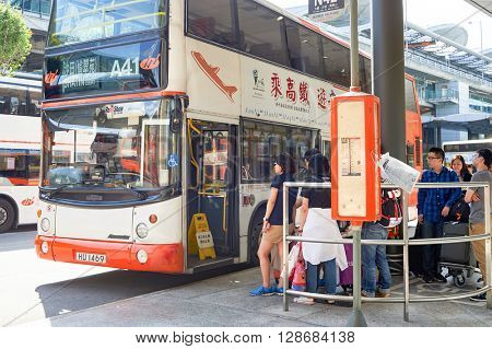 HONG KONG - JUNE 04, 2015: people waiting for boarding at A41 in airport. Hong Kong International Airport is the main airport in Hong Kong. It is located on the island of Chek Lap Kok