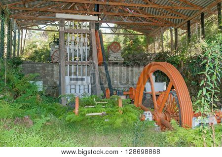 MILLWOOD SOUTH AFRICA - MARCH 4 2016: Overgrown mining equipment at the historic Bendigo gold mine at Church Millwood. All mining operations stopped in 1892
