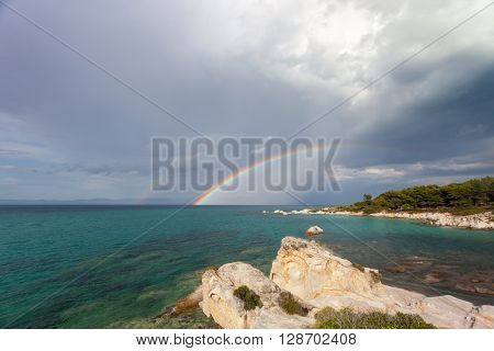 rainbow over the aegis in summer after rain