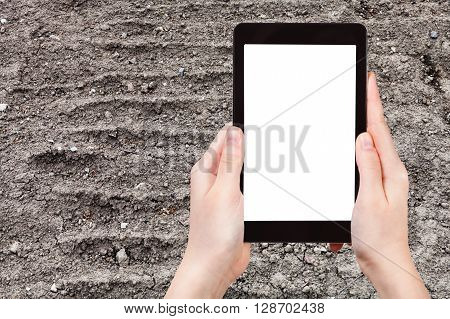 Farmer Photographs Ploughed Field In Spring