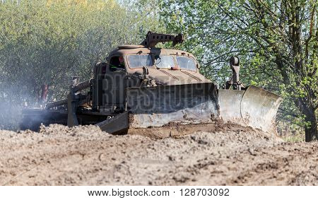 GRIMMEN/ GERMANY - MAY 1: soviet BAT - M military bulldozer drives on track on a motortechnic festival on may 1 2016 in grimmen / Germany.