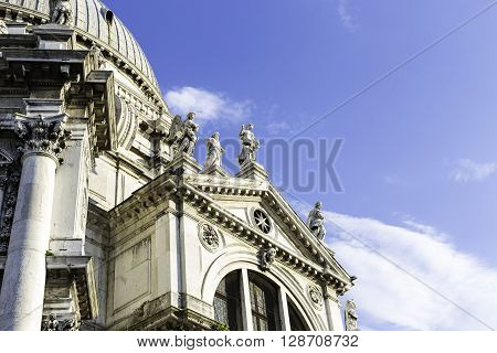 VENICE ITALY - APRIL 22 2015: Closeup view of Santa Maria della Salute which is a Roman Catholic church and minor basilica located at Punta della Dogana in the Dorsoduro sestiere of the city of Venice Italy.