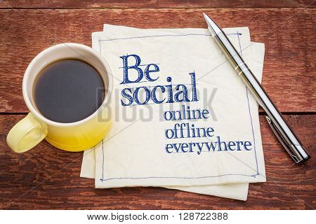 Be social online, offline, everywhere - handwriting on a napkin with a cup of coffee