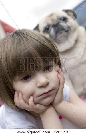 Child And Pug Dog