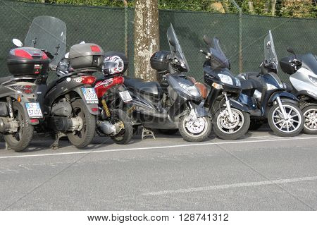 SIENA ITALY - CIRCA APRIL 2016: Motorbicycles parked on a street in the city centre