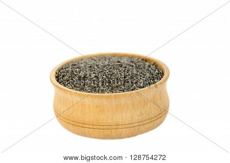 Poppy seeds in a plate isolated on white background