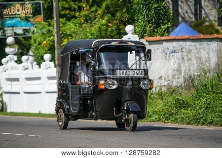 Bentota, Sri Lanka - December 31, 2015: Tuk-tuk Moto Taxi On The Street. Famous Thai Moto-taxi Calle