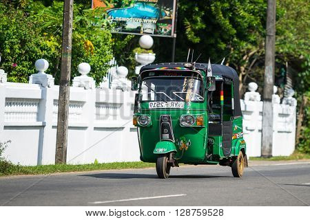 Bentota, Sri Lanka - December 31, 2015: Tuk-tuk Moto Taxi On The Street. Famous Thai Moto-taxi Calle