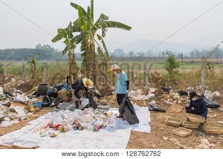 PAI, THAILAND - April 10, 2016 : Councils officer prepare Screeners in the garbage disposal pond in Pai,Thailand