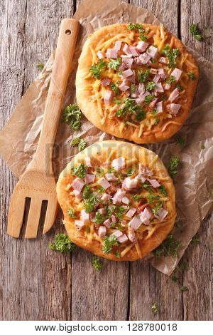 Langos Deep Fried With Cheese And Ham Close-up. Vertical Top View