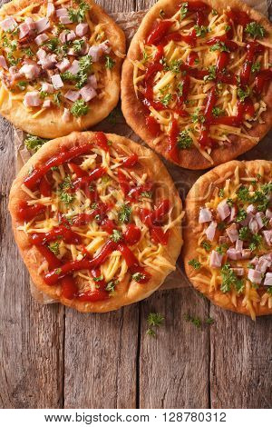 Hot Langos With Cheese, Ketchup And Ham Close-up. Vertical Top View