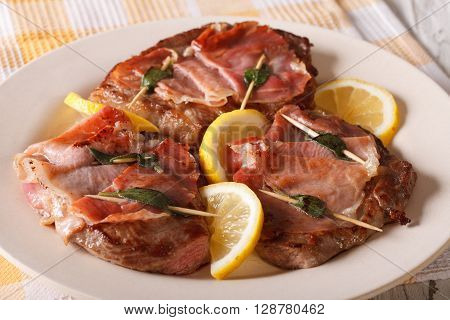 Italian Beef Saltimbocca With Sage, Ham And Lemon Close-up. Horizontal