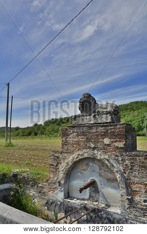 A public drinking water fountain outside the hamlet of Soravilla near Cividale del Friuli Italy