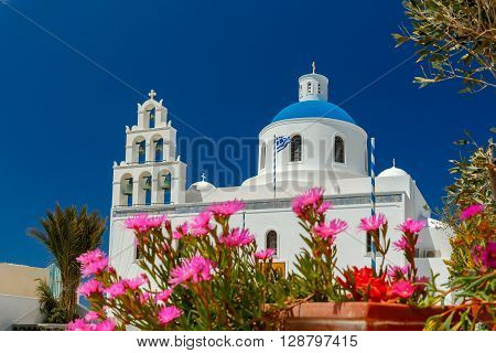 Main white blue orthodox church of Panagia Platsani, in the village of Oia. Santorini.
